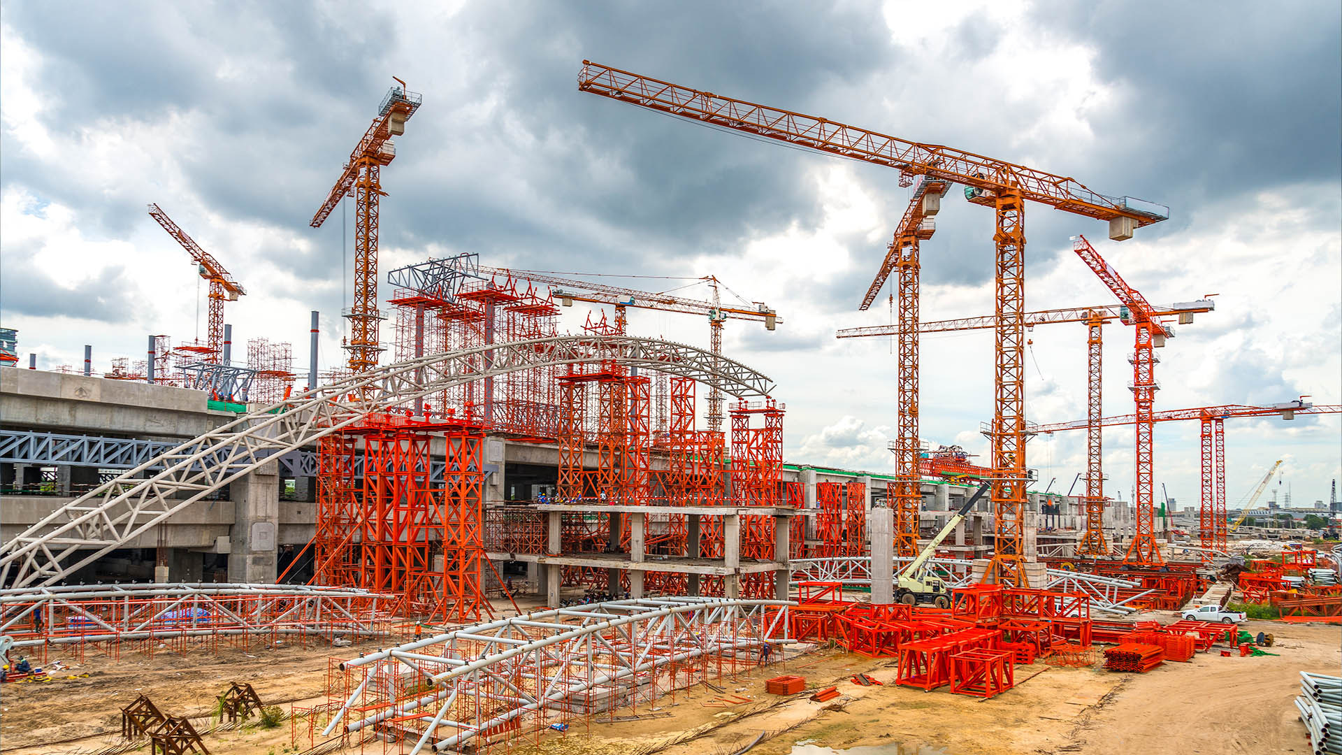 Construction site with cranes representing industrial ERP context